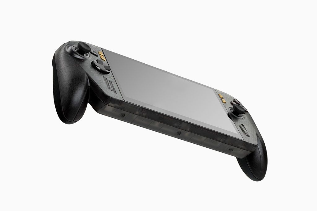 An ROG Xbox Ally X with a tempered glass screen protector applied. A knife is touching the screen protector, showcasing scratch resistance