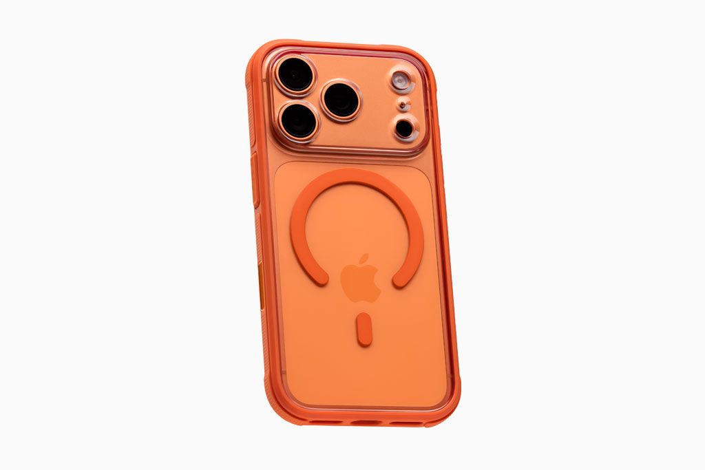 An orange iPhone 17 Pro Max with a dbrand Ghost Case installed. 