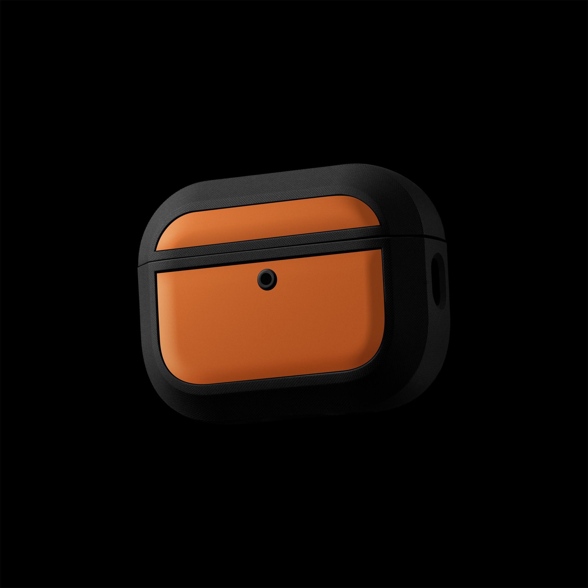 The front of an AirPods Pro 3, with our Grip Case applied to it. The Grip Case has our Cosmic Orange Skin applied to it.