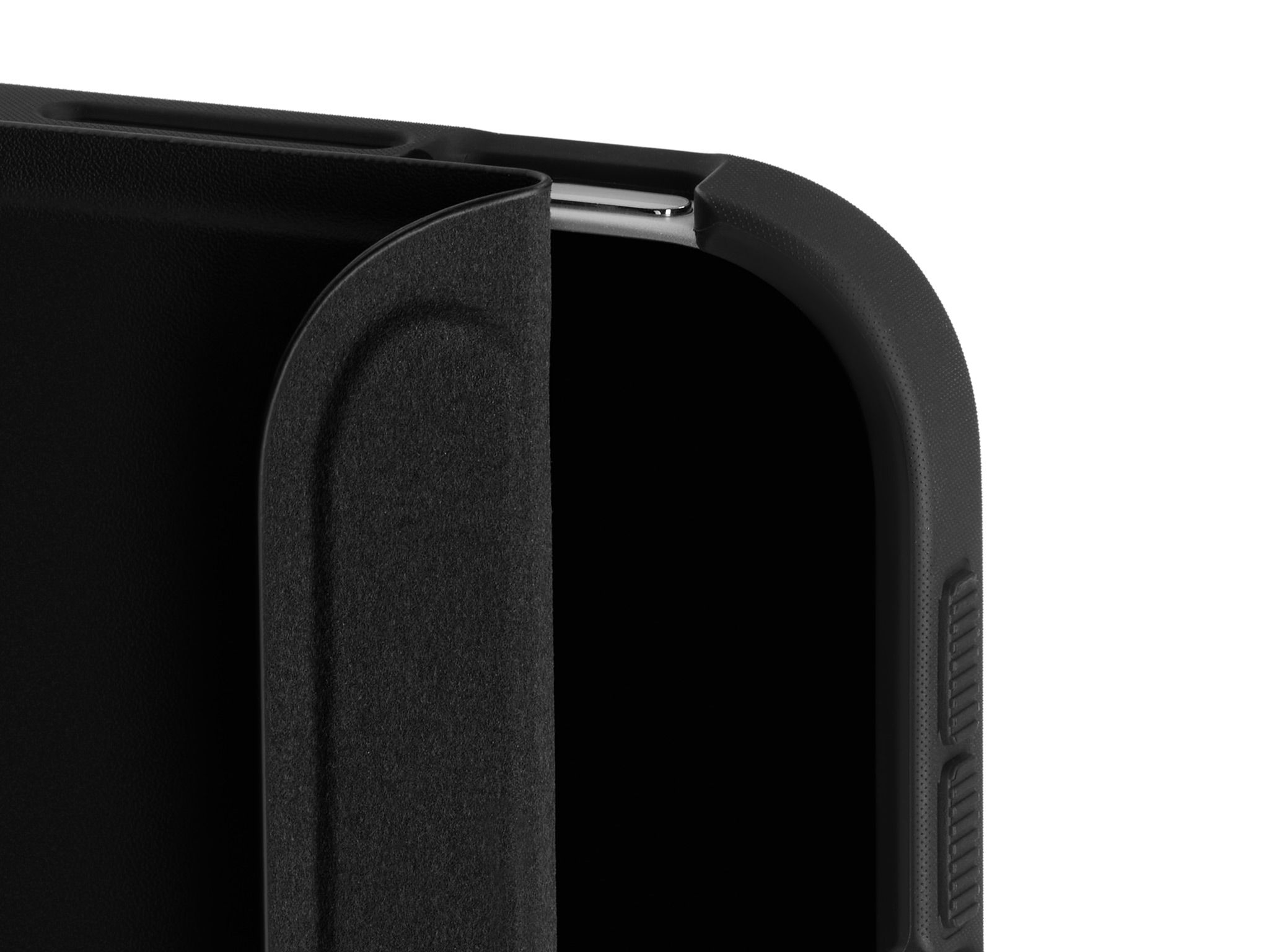 A close-up of the top corner of our iPad Folio Grip with the Folio slightly unfurled, detailing the inner suede lining.
