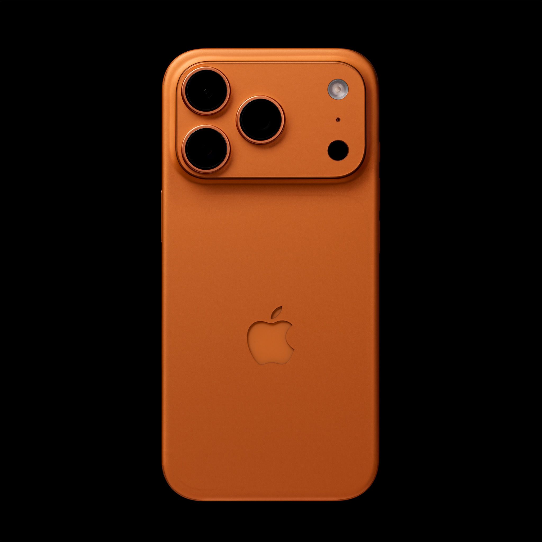 The back of a Cosmic Orange iPhone 17 Pro Max, skinned with our Cosmic Orange Skin. The camera cutouts, LIDAR/flash cutouts, and the logo cutout are all unobstructed.