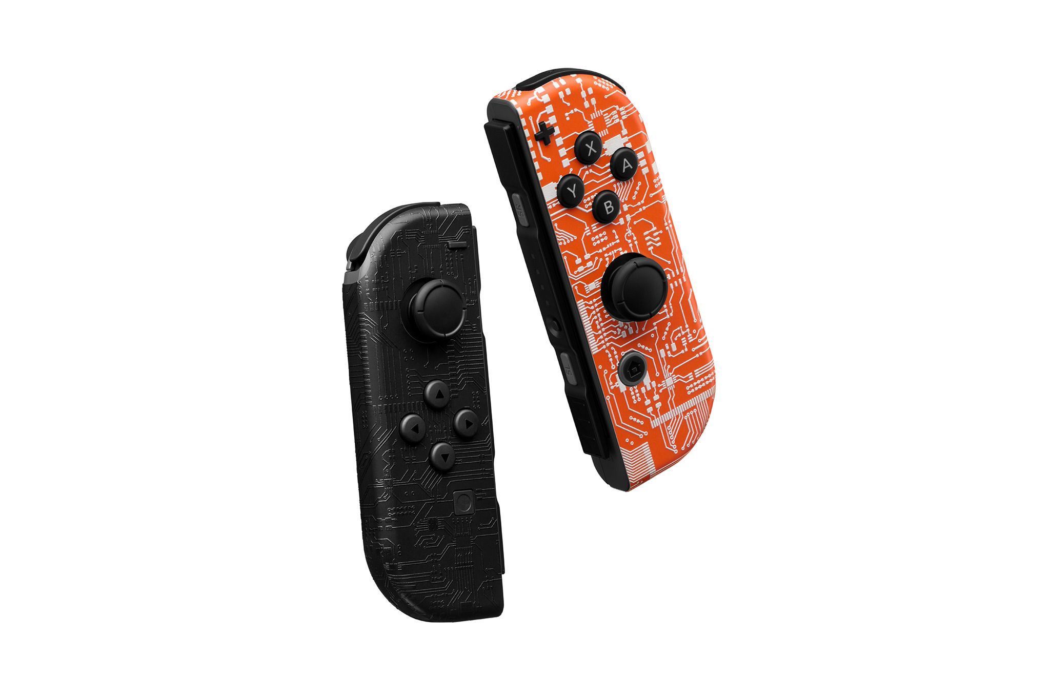 Two Switch 2 Joy-Cons floating against a white backdrop. The left Joy-Con is skinned in our Dark Circuit material, and the right Joy-Con is skinned in our Short Circuit material.