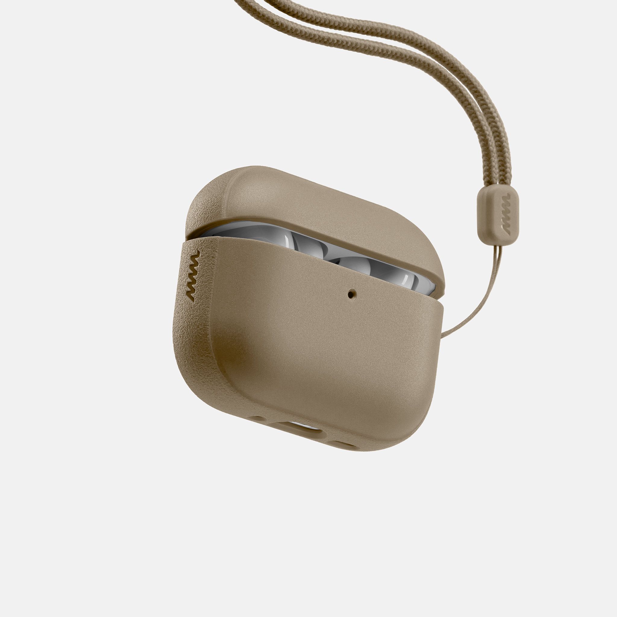 A Tan case for the AirPods with a matching tan lanyard looped through the AirPods lanyard loop.