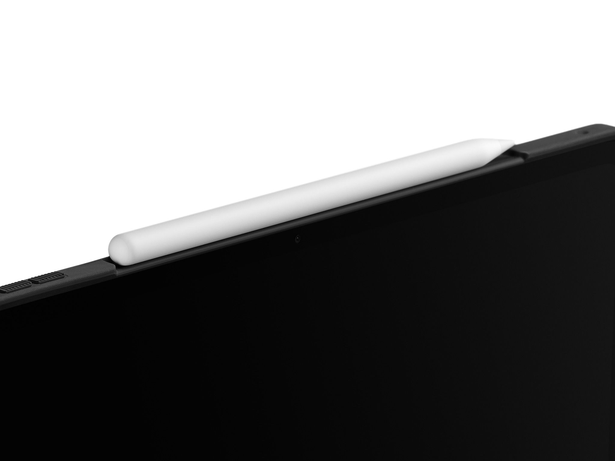 A close-up of the divot in our iPad Folio Case, with an Apple Pencil magnetically attached to the frame of the device.