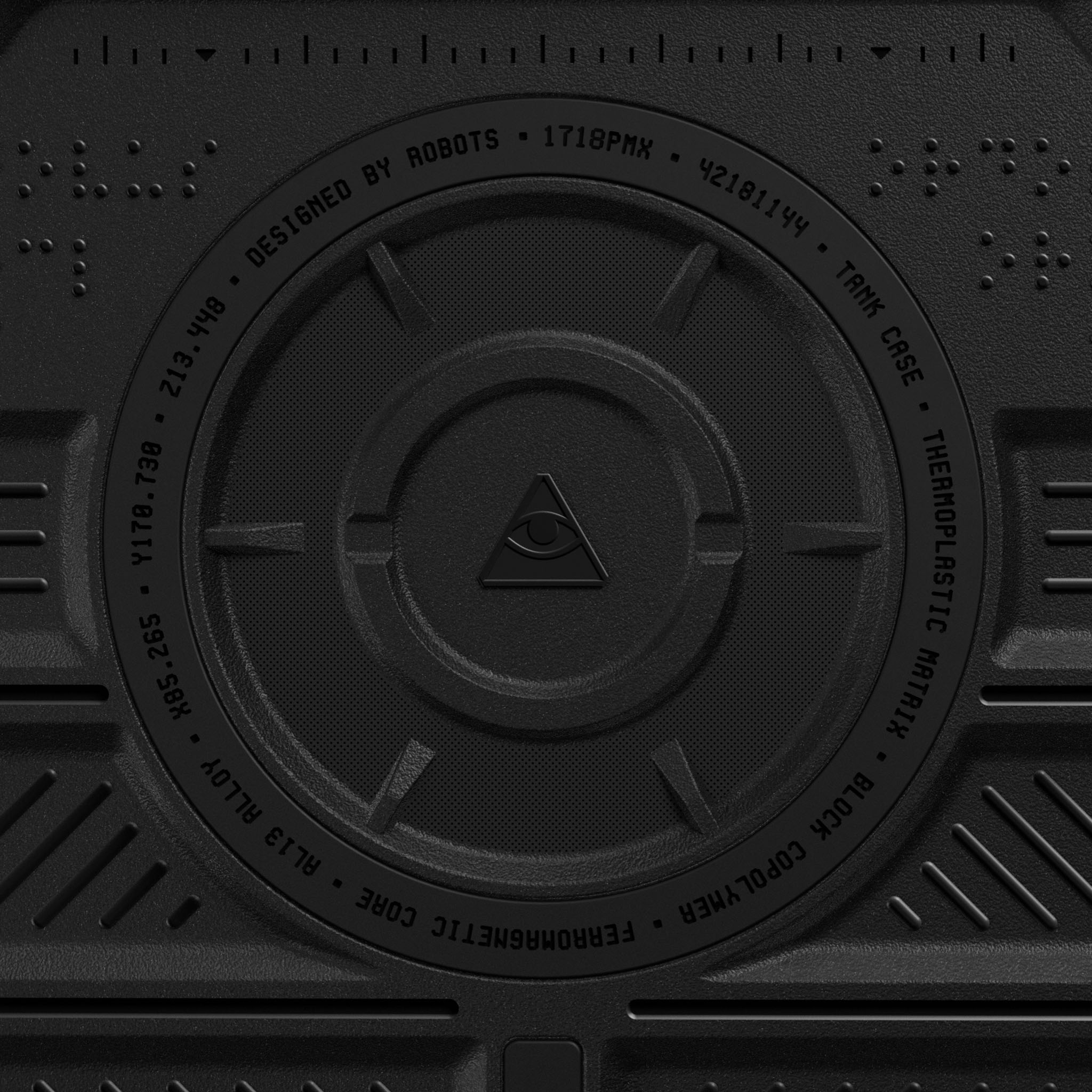 A close-up on the center magnetic module of our Tank Case, showing a triangle with an eye in the middle surrounded by ridges and text.