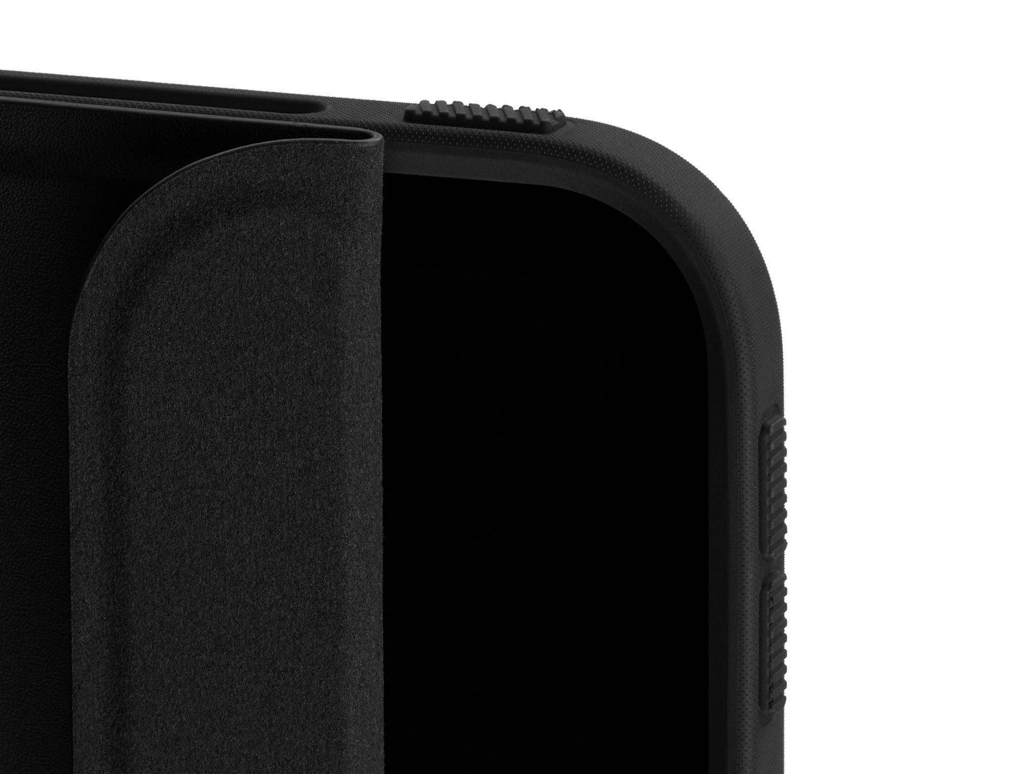 A close-up of the top corner of our iPad Folio Grip with the Folio slightly unfurled, detailing the inner suede lining.